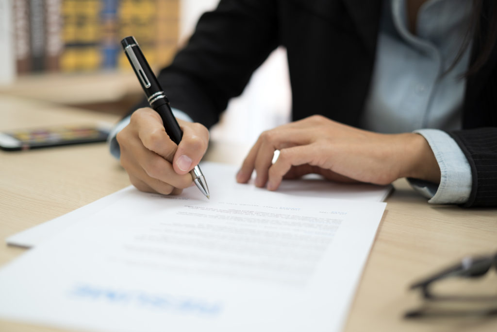 Woman signing job contract