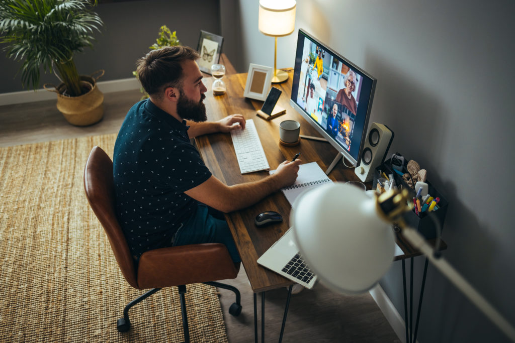 Businesspeople discussing business on virtual staff meeting during pandemic